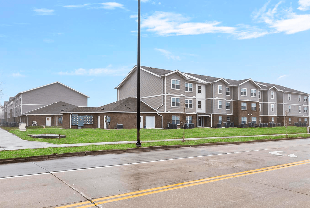 an apartment building on the side of a street