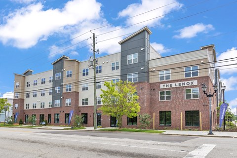 The Lenox building is a multi-story structure with a mix of brick and panel siding.