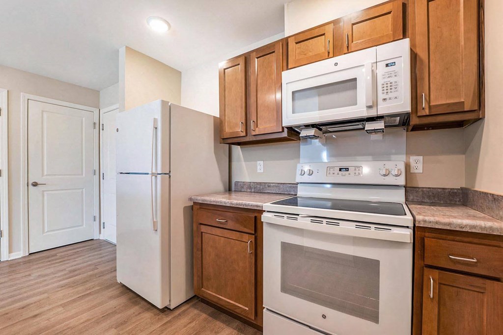 a kitchen with a stove microwave and refrigerator