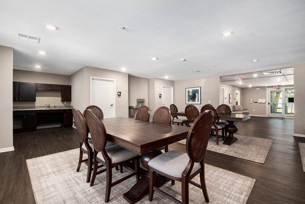 a large dining room with a large table and chairs