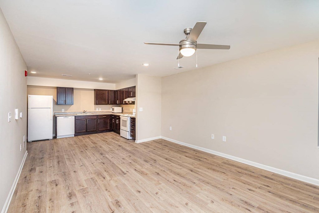 A kitchen with a white refrigerator, a white dishwasher, and a white oven.