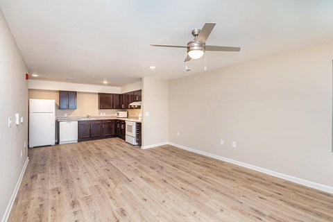 A kitchen with a white refrigerator, a white dishwasher, and a white oven.