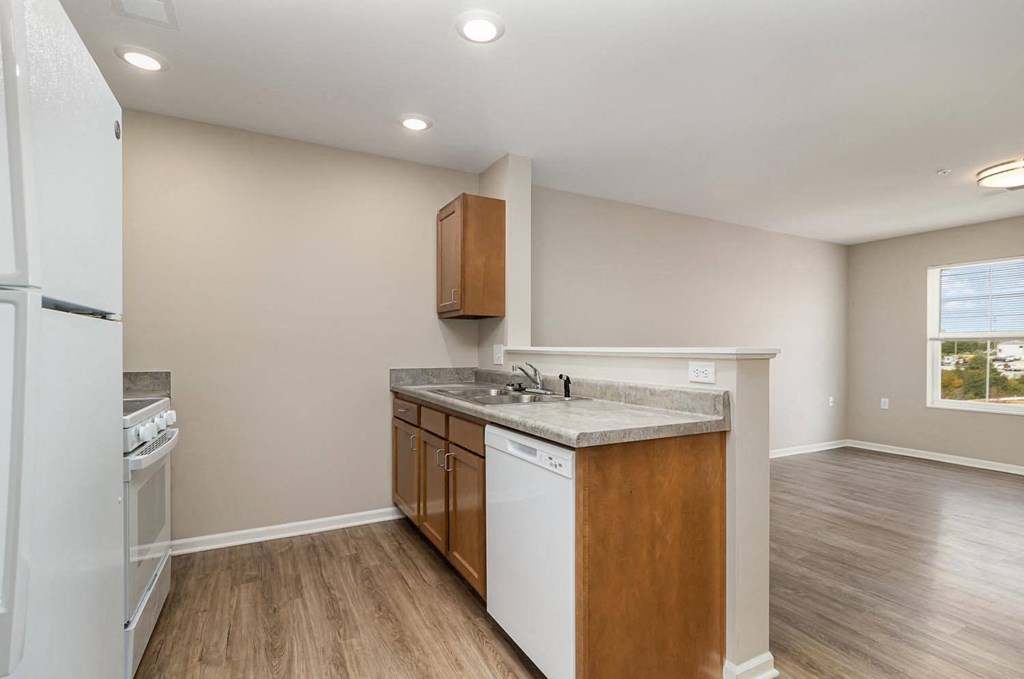 a kitchen with a sink and a refrigerator