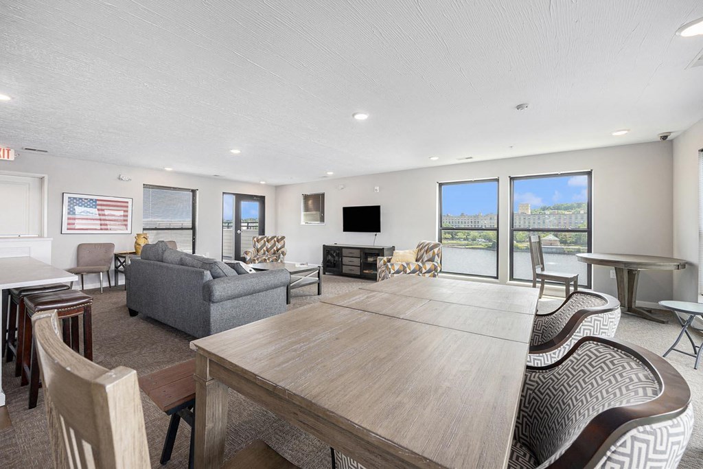 a living room with a wooden table and a couch and a tv