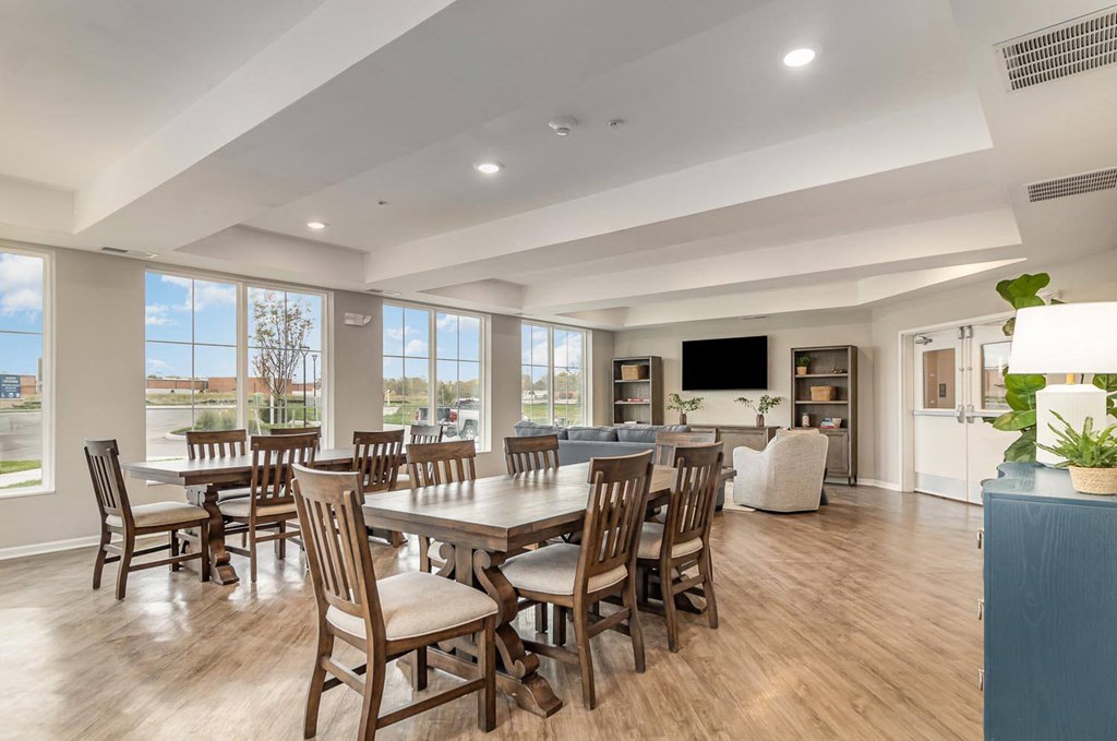 a large dining room with a table and chairs