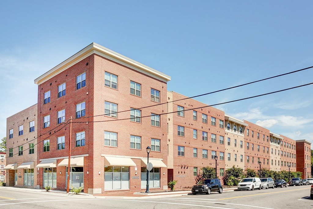 a large brick building on the corner of a city street