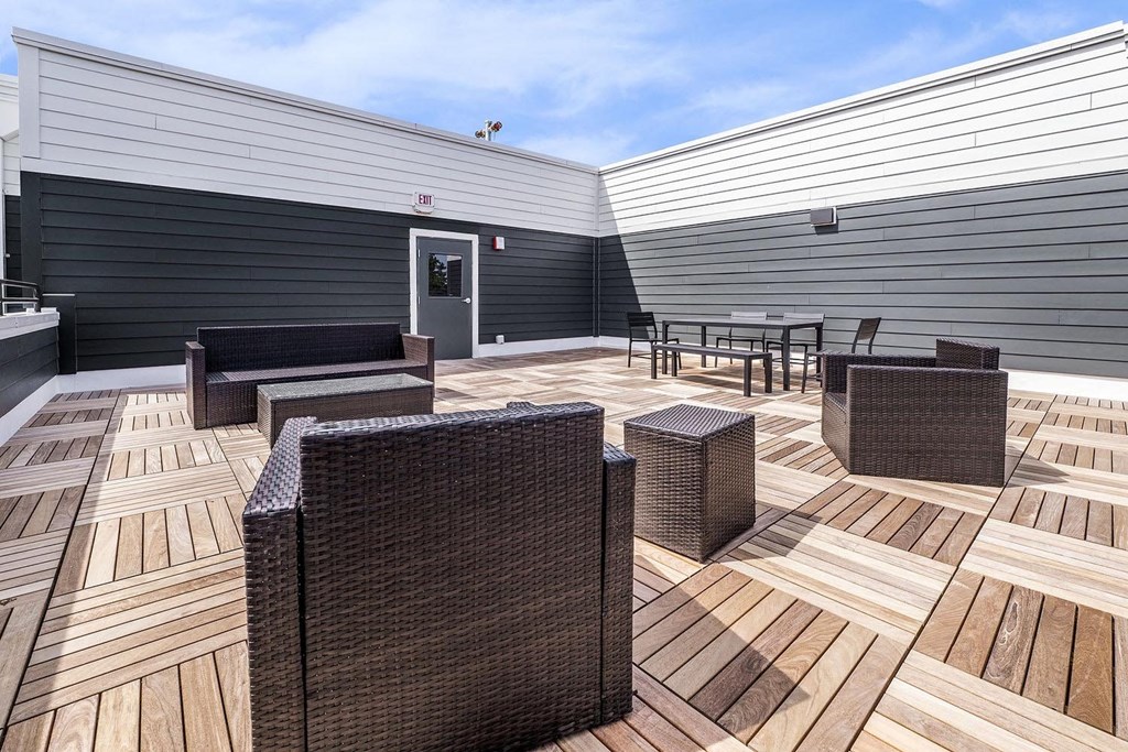 the deck of the home has seating and tables