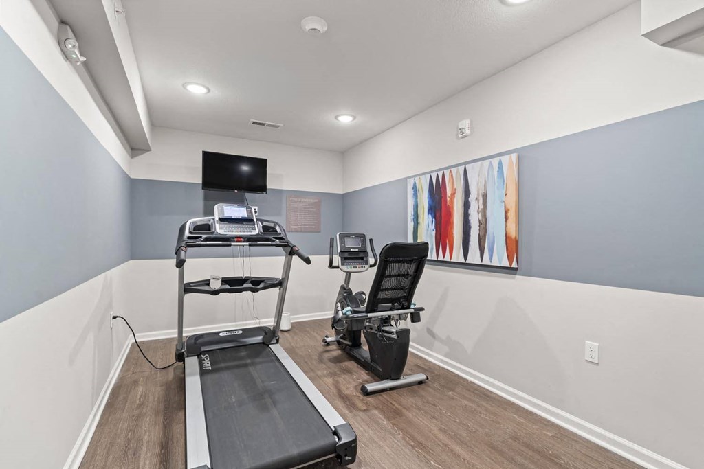 our apartments have a gym with equipment and a flat screen tv