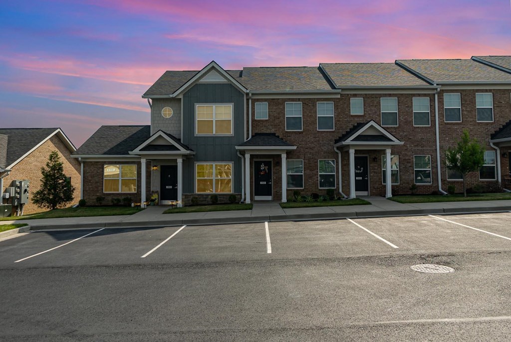 a building with a parking lot in front of it