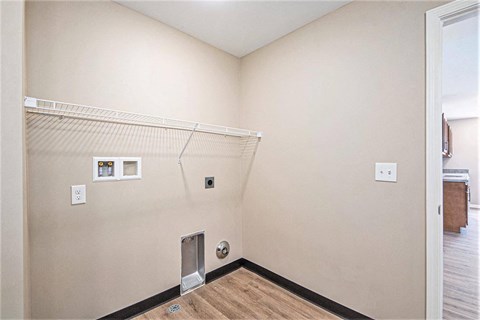 A room with a white wall and a white door.