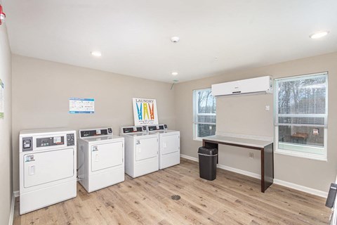 Laundry room with washers and dryers.