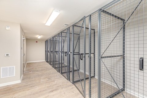 A long hallway with a metal fence on the right side.