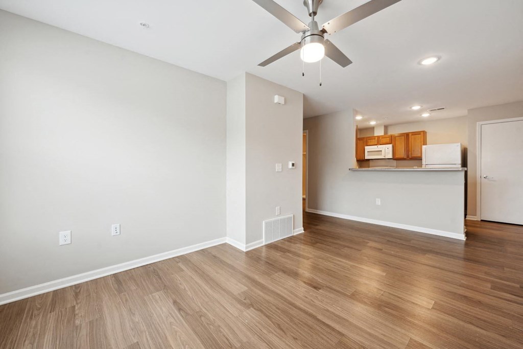 the living room and kitchen in a 555 waverly unit