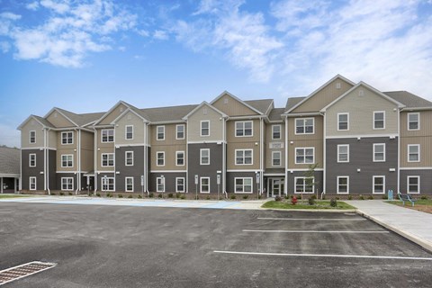 A large apartment complex with multiple buildings and parking lots.