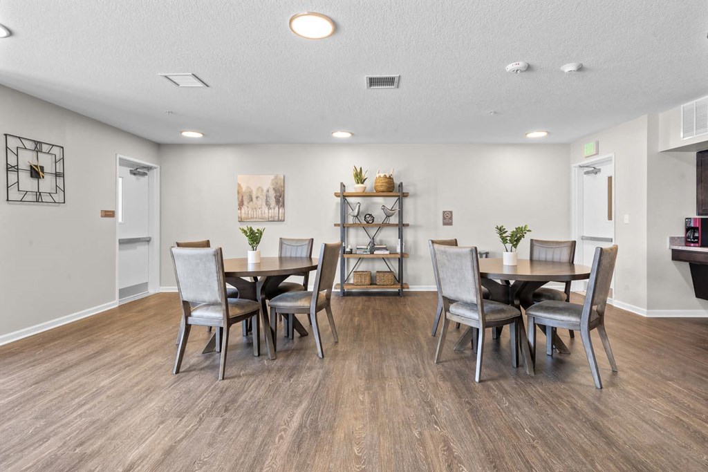 a dining room with a table and chairs