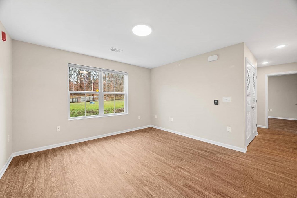 A room with a window and a door.