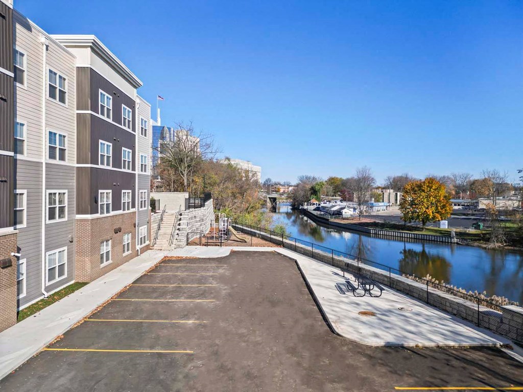 a view of a river with a building and a boat dock