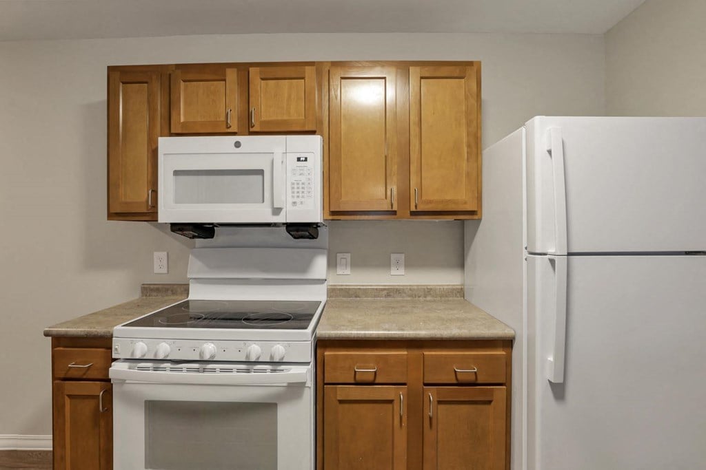 a kitchen with a stove microwave and refrigerator