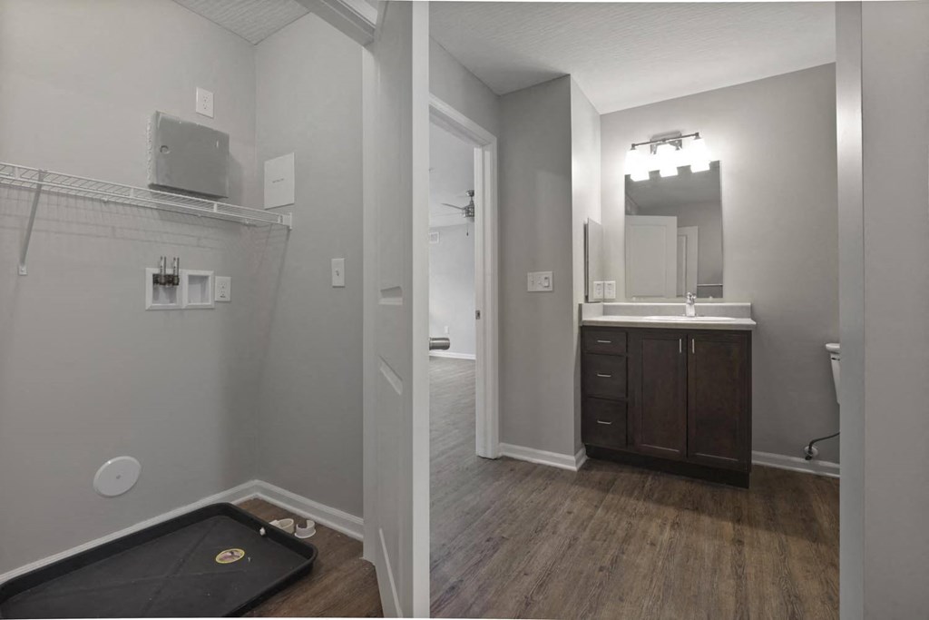 a bathroom with a sink and a mirror and a bath tub