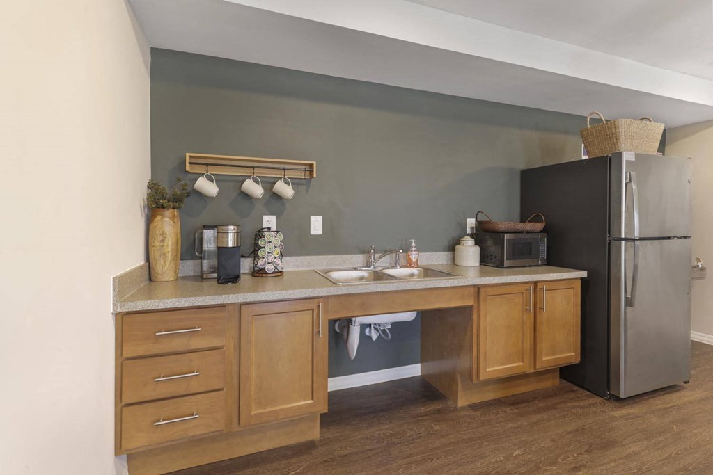 a kitchen with a sink and a refrigerator