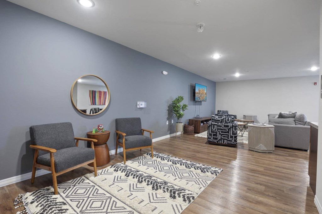 a living room with a couch and a mirror