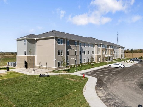 a large building with a car parked in front of it