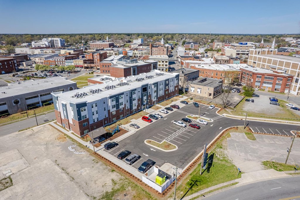 an aerial view of an apartment building in a city