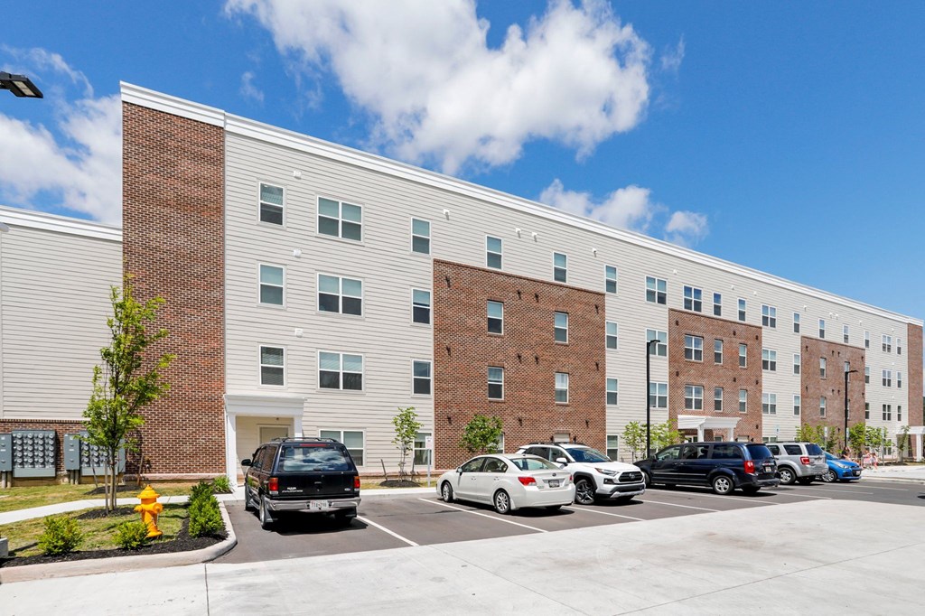 a large building with a parking lot in front of it