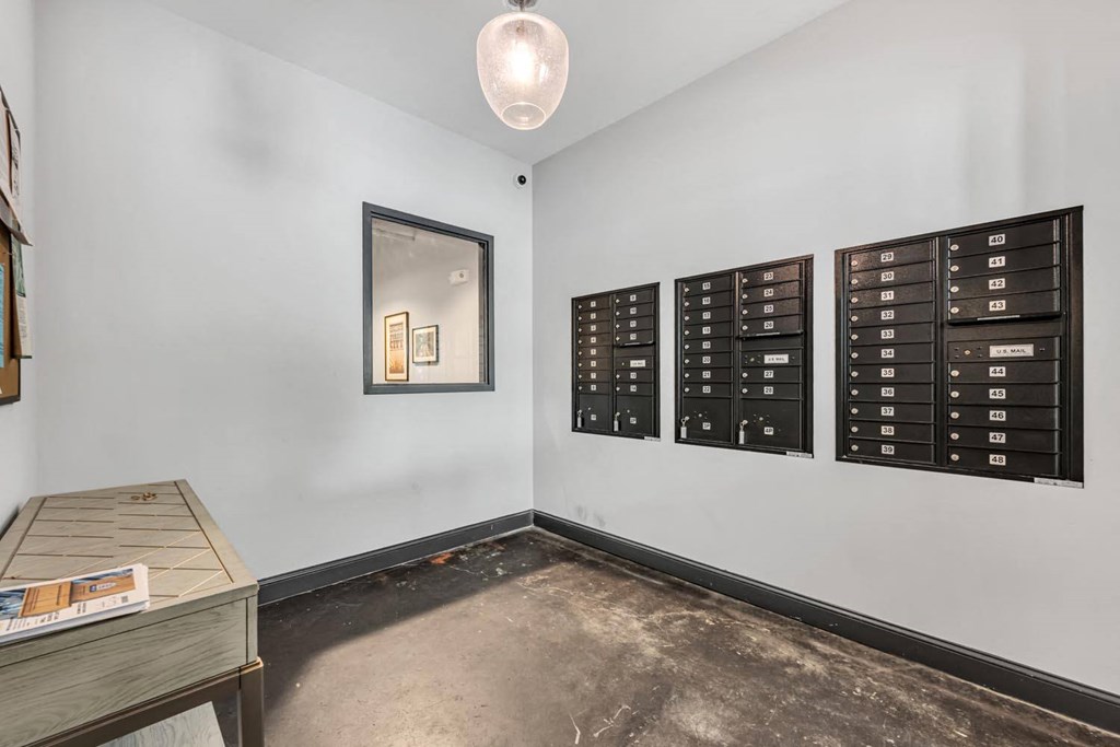 a room with mailboxes and a table