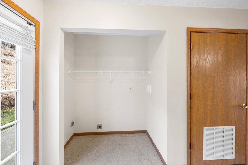 a empty room with a closet and a door
