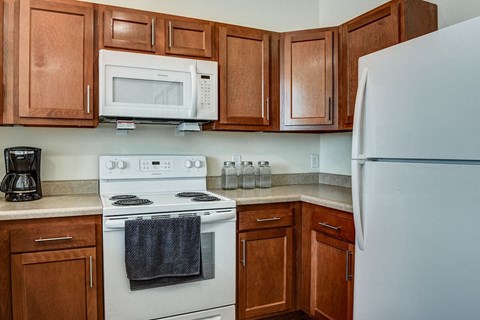 a kitchen with a stove microwave and refrigerator