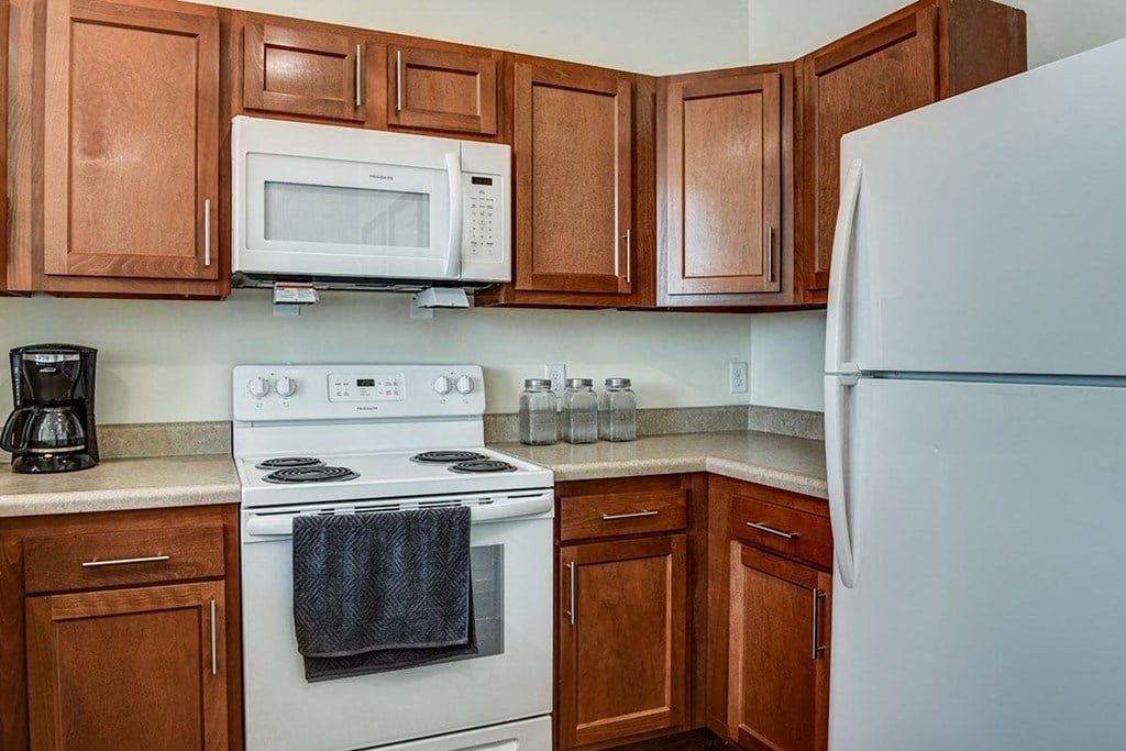a kitchen with a stove microwave and refrigerator