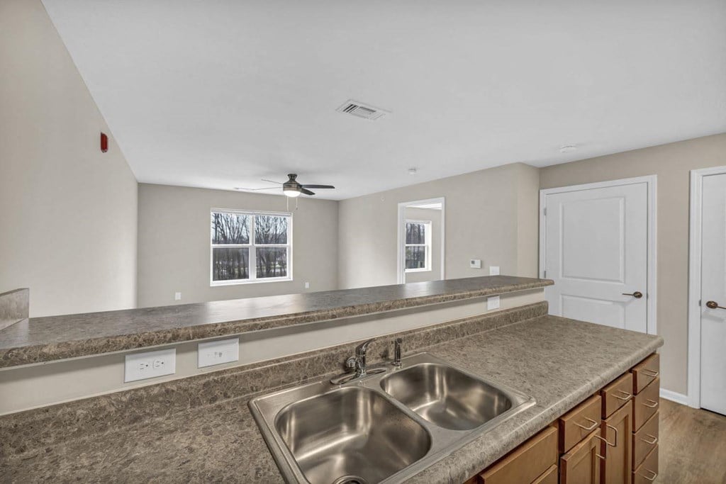 a kitchen with a sink and a counter top
