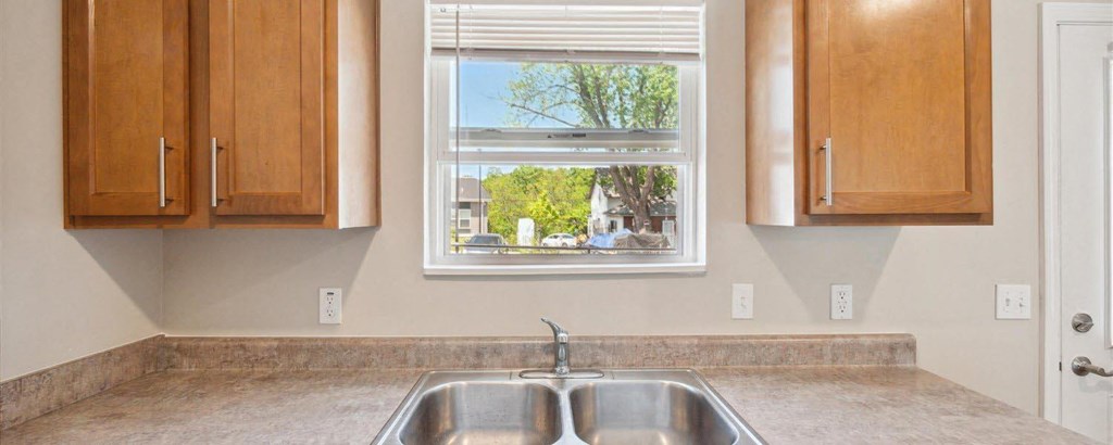 a kitchen with a sink and a window