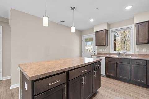 A kitchen with brown cabinets and a countertop.