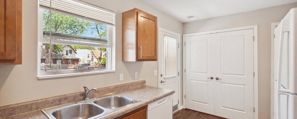 a kitchen with a sink and a window