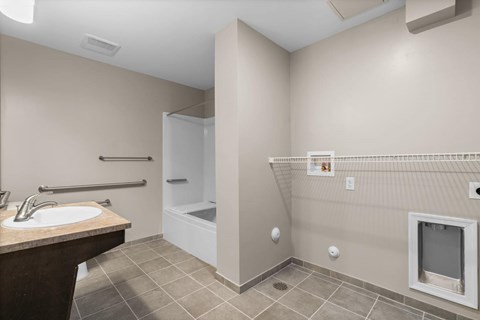 A bathroom with a sink, toilet, and shower.