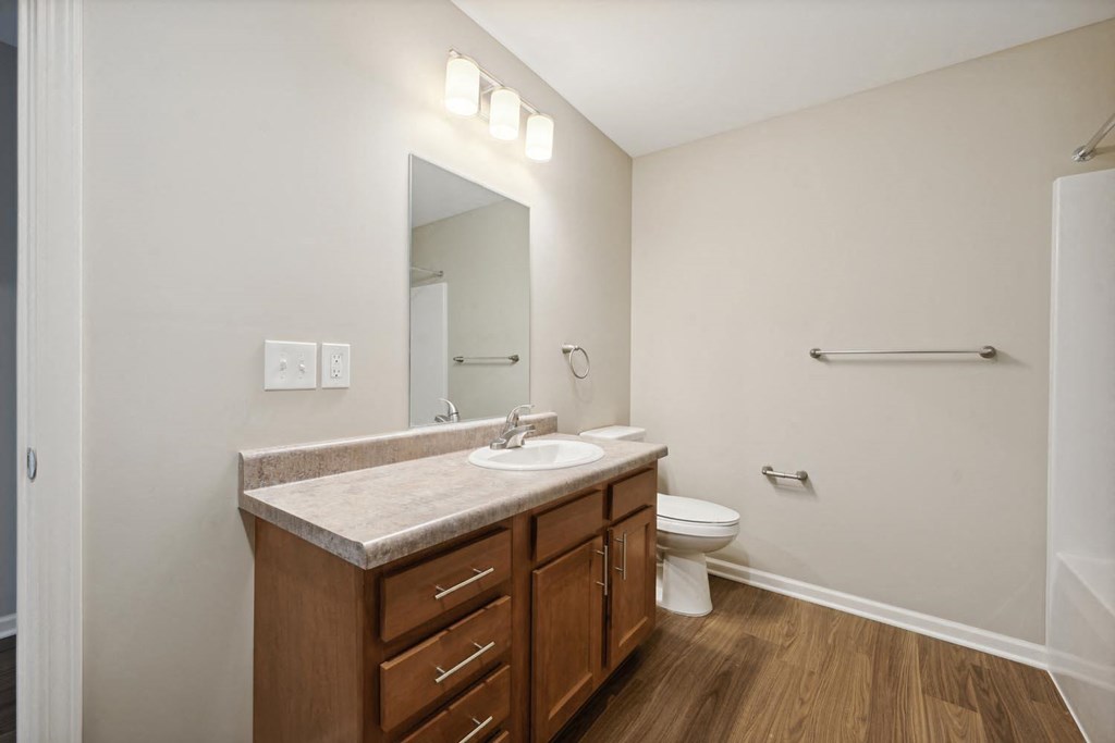 a bathroom with a sink and toilet in a 555 waverly unit