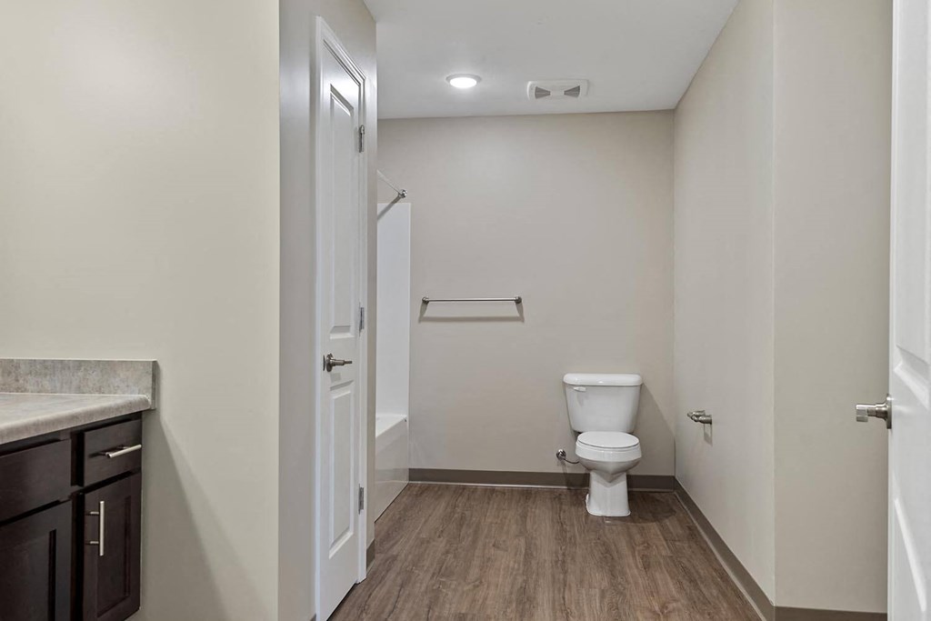 a bathroom with a toilet and a sink