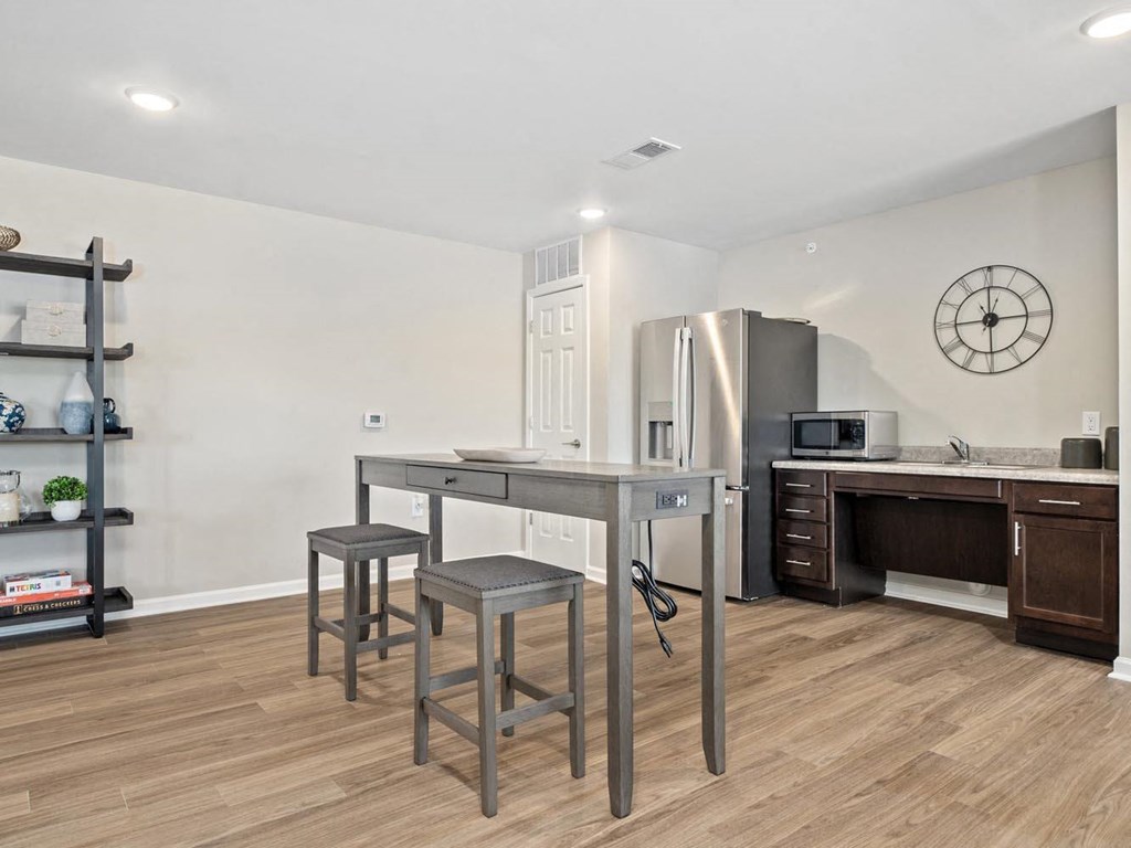 a kitchen with a counter top and a refrigerator