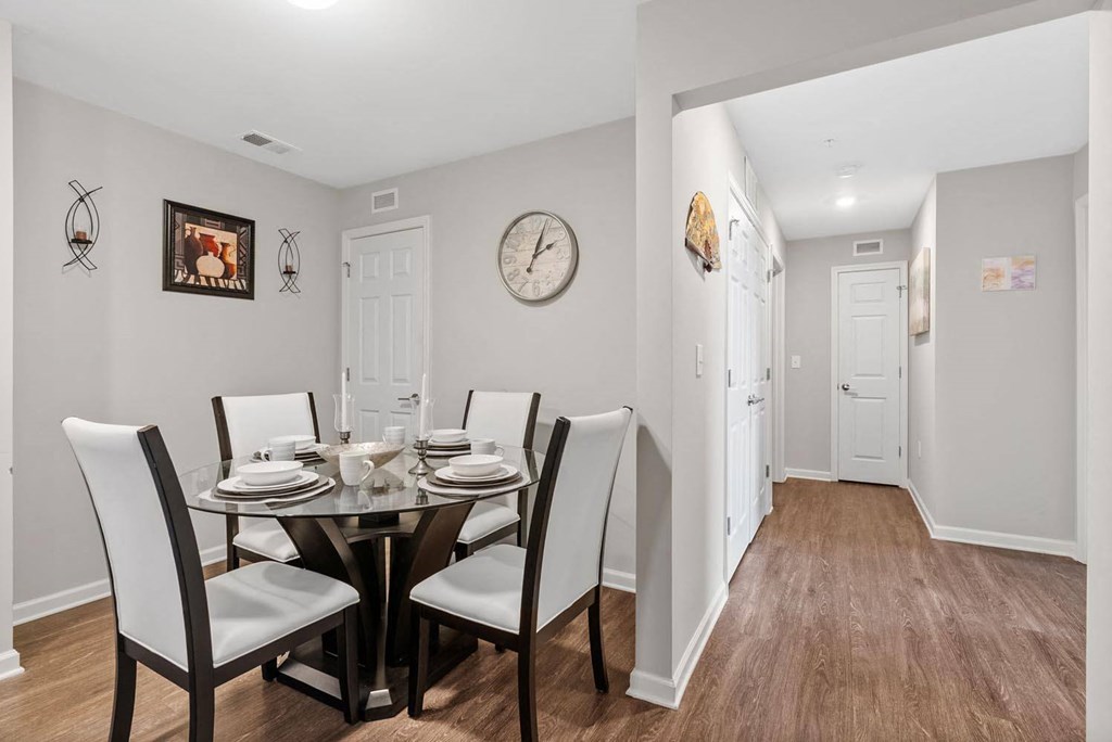 a dining room with a table and chairs