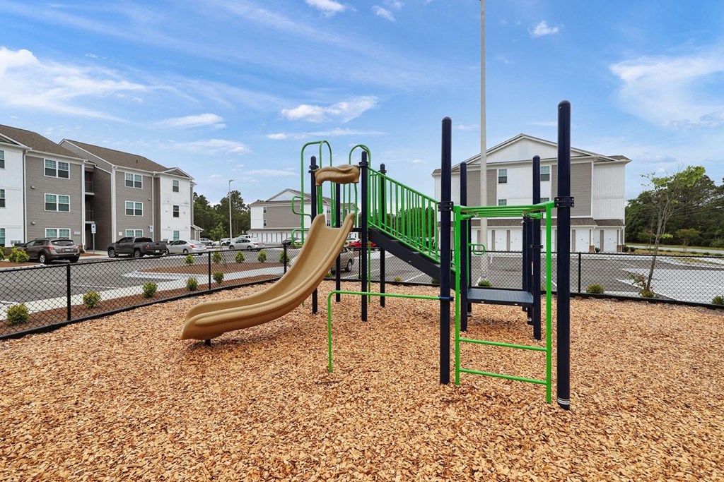 a playground with a slide and monkey bars