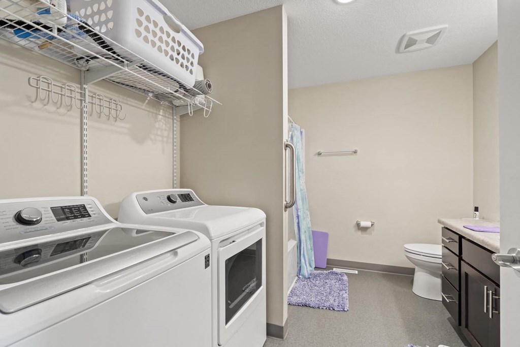 a laundry room with a washer and dryer