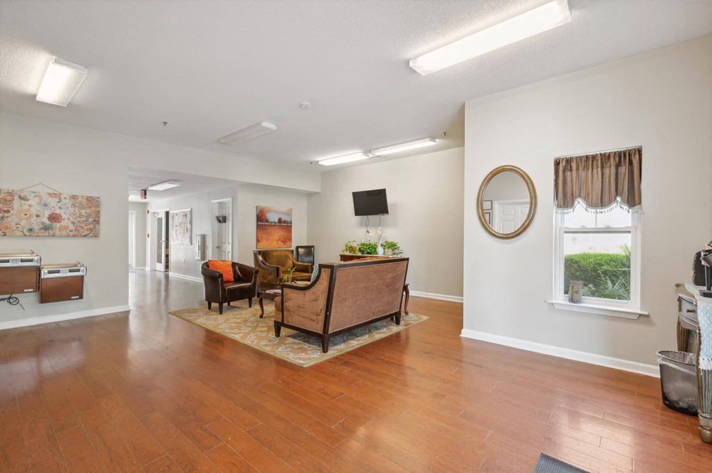 a living room with a couch and a piano