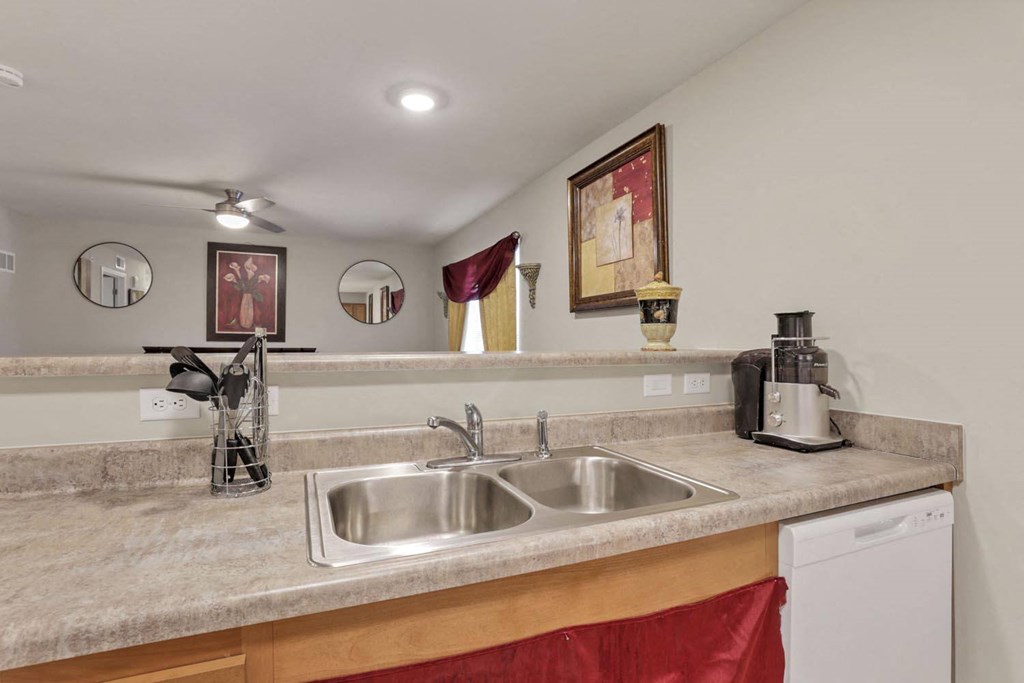 a kitchen with a sink and a counter top
