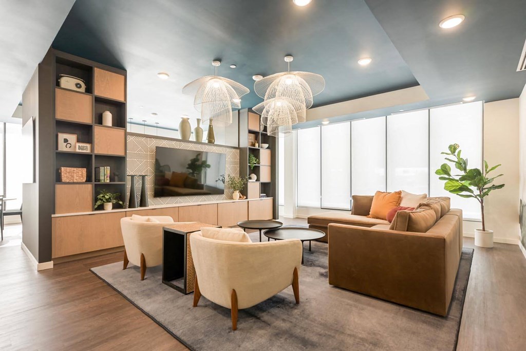 a living room with couches and chairs