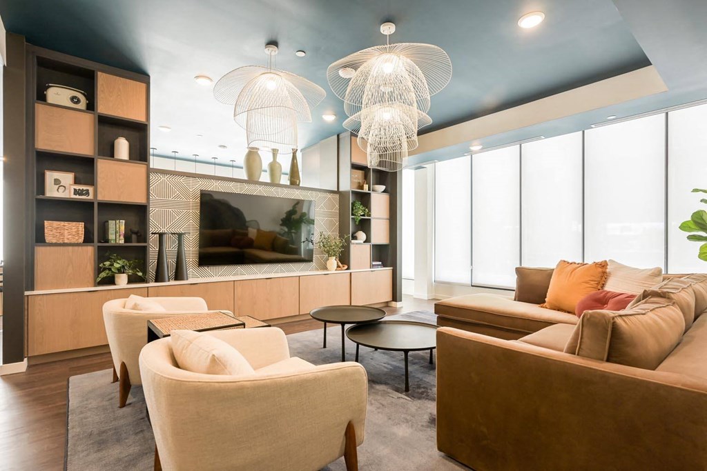 a living room with couches and chairs