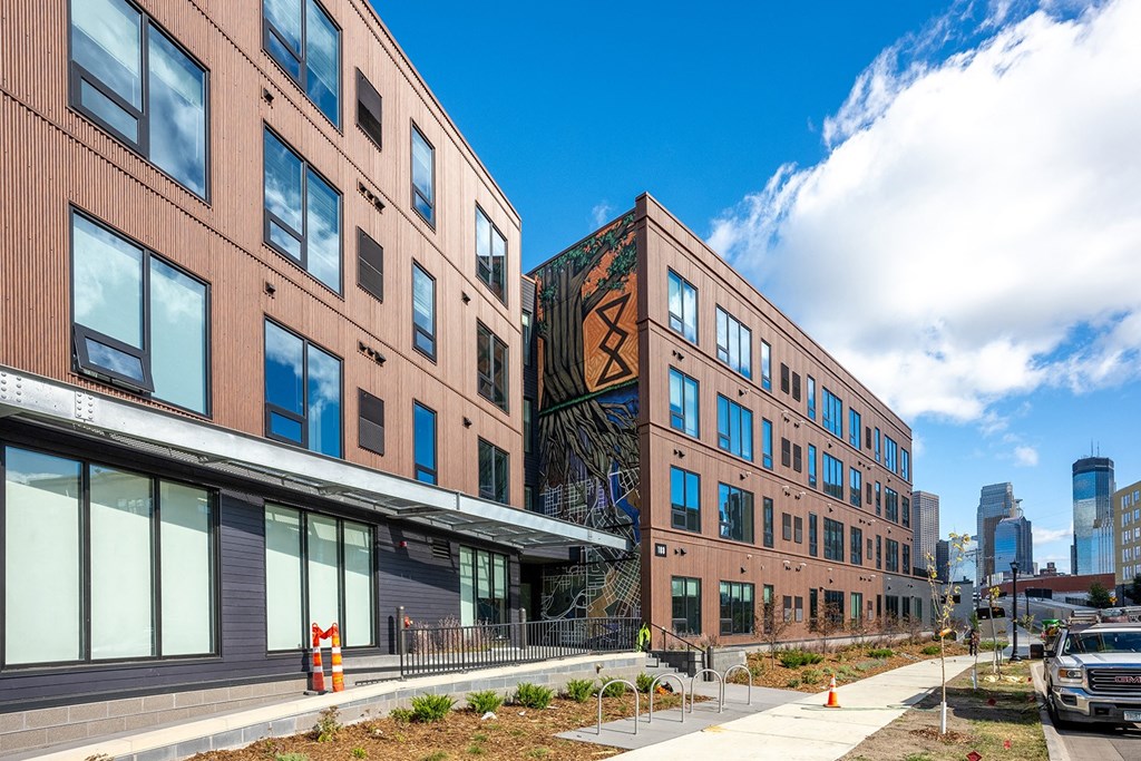 a group of buildings with a city in the background