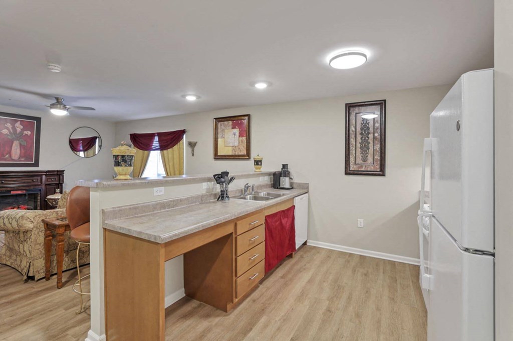 a kitchen with a counter top and a refrigerator