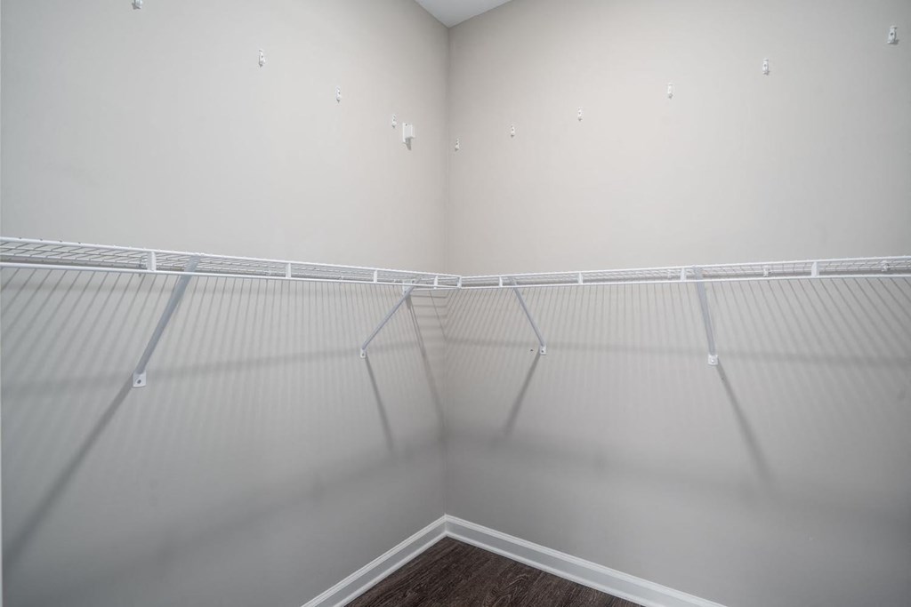 a large empty closet in a room with white walls